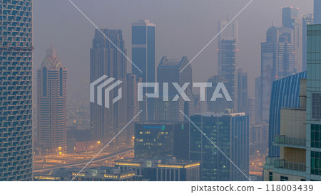 Foggy morning in downtown of Dubai night to day timelapse. 118003439