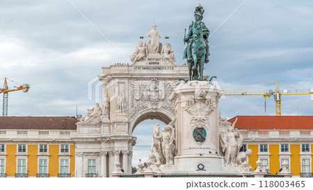 Triumphal arch at Rua Augusta and bronze statue of King Jose I at Commerce square timelapse in Lisbon, Portugal. 118003465