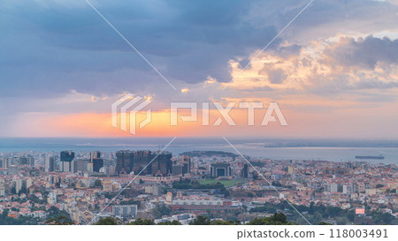 Panoramic sunrise view over Lisbon and Almada from a viewpoint in Monsanto morning timelapse. 118003491