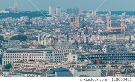 Aerial panorama above houses rooftops in a Paris day to night timelapse Aerial panorama above houses rooftops in a Paris day to night timelapse 118003495