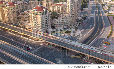Aerial view of highway interchange in Dubai downtown evening timelapse. 118003516