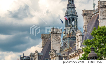 Architecture of The Hotel de Ville City Hall with french flag on tower timelapse, the building housing the local administration of the city of Paris 118003563