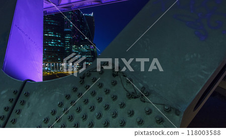 Moscow river near the skyscrapers of Moskva City district in the night timelapse view under the bridge. Moscow river near the skyscrapers of Moskva City district in the night timelapse view under the bridge. 118003588