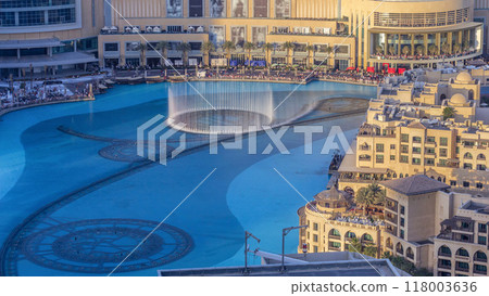 Evening aerial view Dancing fountains downtown and in a man-made lake timelapse in Dubai, UAE. Evening aerial view Dancing fountains downtown and in a man-made lake timelapse in Dubai, UAE. 118003636