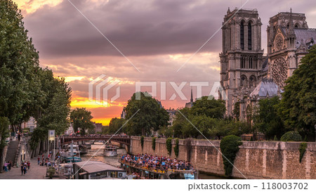 Cathedral Notre Dame de Paris day to night timelapse after sunset in Paris, France. 118003702