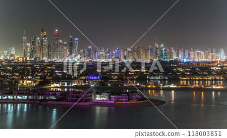 Jumeirah Palm island skyline night timelapse in Dubai, UAE. 118003851