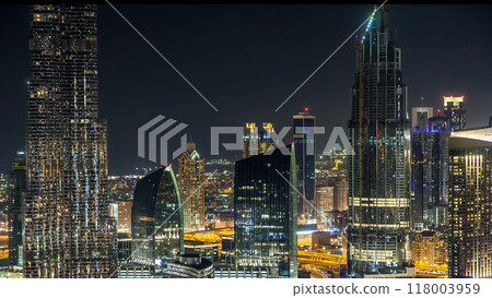 Dubai downtown skyline timelapse at night. Rooftop view of Sheikh Zayed road with numerous illuminated towers. Dubai downtown skyline timelapse at night. Rooftop view of Sheikh Zayed road with numerous illuminated towers. 118003959