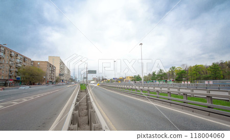 Traffic jams of roadside, transportation motion in a big city. Rush hour traffic on a city roads timelapse. Traffic jams of roadside, transportation motion in a big city. Rush hour traffic on a city roads timelapse. 118004060