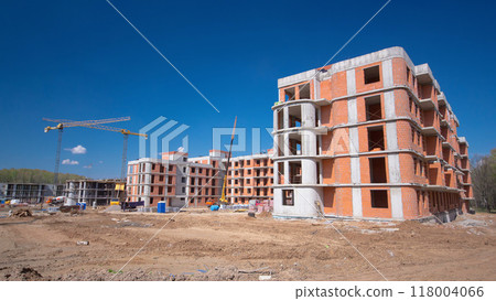 Large construction site with buildings under construction and multi-storey residential homes timelapse. Large construction site with buildings under construction and multi-storey residential homes timelapse. 118004066