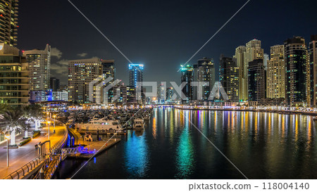 Dubai Marina towers and yachts in Dubai at night timelapse hyperlapse 118004140