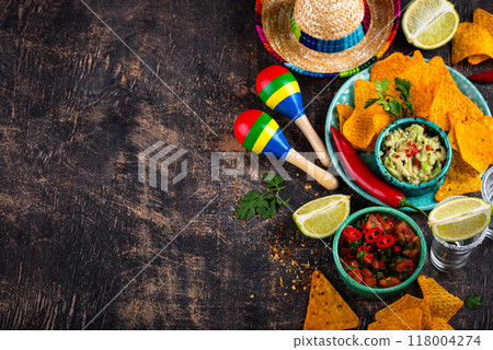 Traditional Mexican food nachos, salsa, guacamole, tequila. 118004274