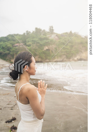 Young woman relaxing at the seaside Young woman relaxing at the seaside 118004468