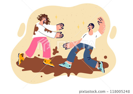 Cheerful man and woman fight in mud, enjoying opportunity to have fun and relax in fresh air 118005248