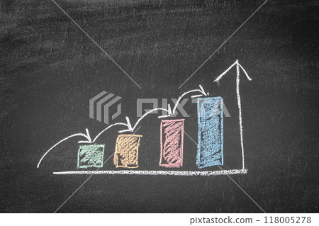 Colorful graph of development and profit. Wooden human figures on a chalkboard background Colorful graph of development and profit. Wooden human figures on a chalkboard background 118005278