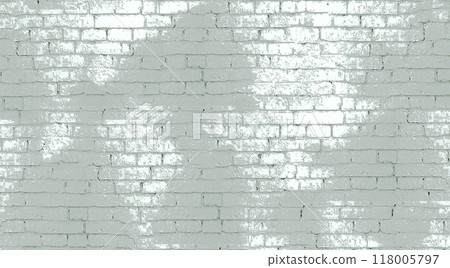 A white brick wall with patches of gray paint 118005797