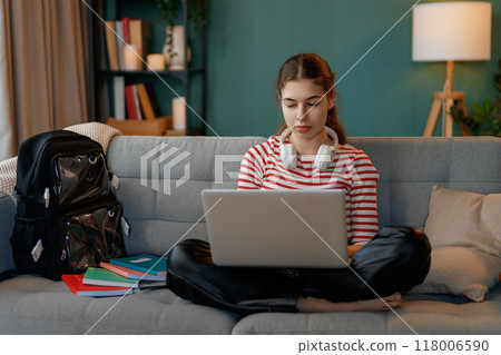 Girl doing homework 118006590