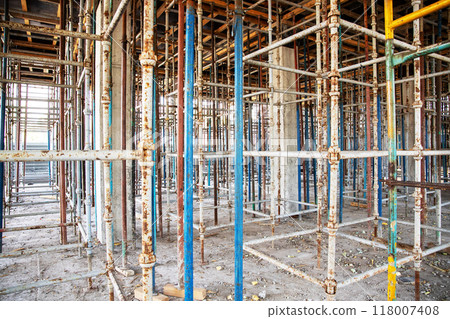 Exposed scaffolding for the ceiling of the 2nd floor for pouring reinforced concrete at the construction site. Exposed scaffolding for the ceiling of the 2nd floor for pouring reinforced concrete at the construction site. 118007408