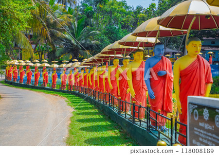 row of Buddhist monk statues in Dambulla row of Buddhist monk statues in Dambulla 118008189