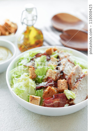 A bowl  of  Caesar salad 118008425
