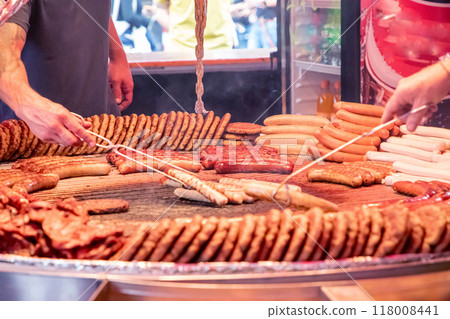 large grill filled with various types of german sausages large grill filled with various types of german sausages 118008441