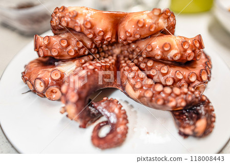 Boiled red octopus is taken out of the pan. Boiled red octopus is taken out of the pan. 118008443