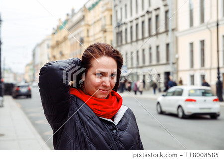 caucasian female woman looking playfully at camera outside. architect, interior designer, businesswoman, marketer. tourism, lifestyle portrait caucasian female woman looking playfully at camera outside. architect, interior designer, businesswoman, marketer. tourism, lifestyle portrait 118008585