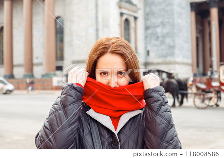 caucasian female woman looking playfully at camera outside caucasian female woman looking playfully at camera outside 118008586