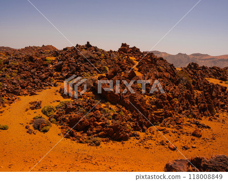 spot in Tenerife with many red rocks and beautiful mountain landscape background 118008849