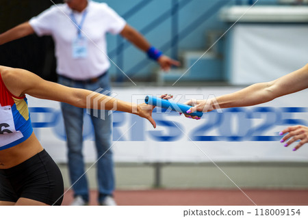 women relay race competition on background banner Sports 2025, concept of new year 118009154