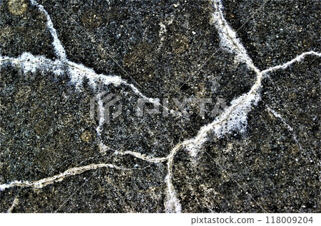 Black and white photo. Old cracked cement plaster. 118009204