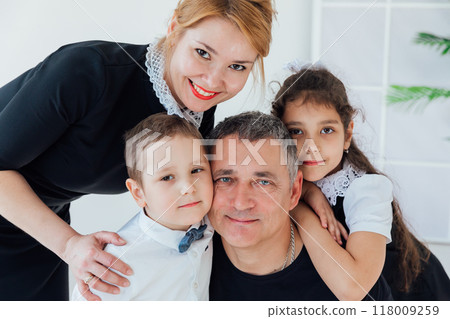 Family Mom, Dad, Son and Daughter Smiling Family Mom, Dad, Son and Daughter Smiling 118009259