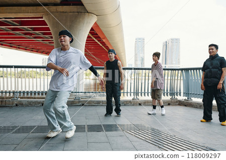 Dancing Enthusiasts Performing Under Urban Bridge 118009297