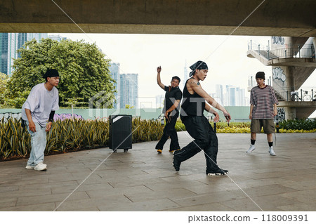 Dancing Outdoors in Urban Setting with Graffiti Background Dancing Outdoors in Urban Setting with Graffiti Background 118009391