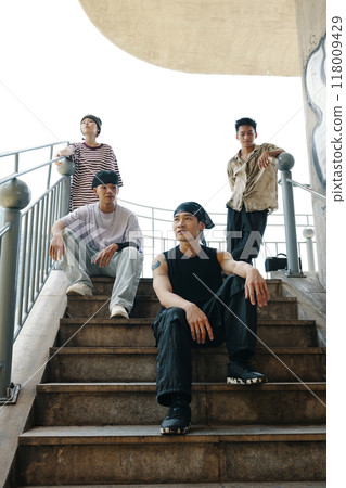 Four Friends Posing on Outdoor Staircase Four Friends Posing on Outdoor Staircase 118009429