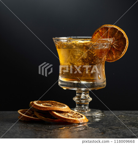 Rum or whiskey in a glass with ice. 118009668