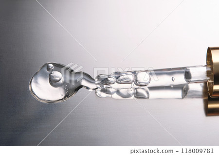 Pipette with cosmetic gel or serum close-up. 118009781