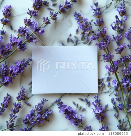 Blank card mockup on a marble background, surrounded by fresh lavender flowers. Perfect for invitations, greetings, and stationary designs. Elegant and minimalistic with a natural, floral aesthetic 118009923