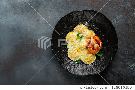 ravioli with shrimp, in cream sauce, with spices and herbs, top view, no people, 118010190