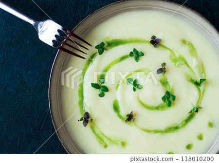 Mashed potatoes, with green butter, micro greenery, homemade, on a dark background, no people, top view, Mashed potatoes, with green butter, micro greenery, homemade, on a dark background, no people, top view, 118010200