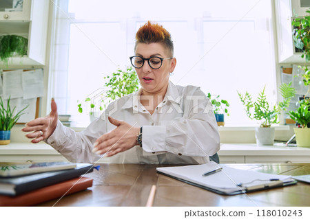 Webcam view of talking middle-aged business woman 118010243