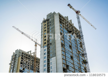Construction of a building. Construction site with crane. Business, development, industry. Construction of a building. Construction site with crane. Business, development, industry. 118010573