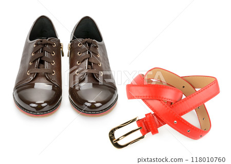 Elegant women's shoes and leather belt isolated on white. Collage. Free space for text. Elegant women's shoes and leather belt isolated on white. Collage. Free space for text. 118010760