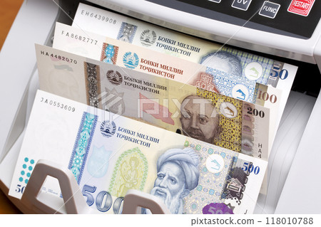 Tajikistani somoni in the counting machine 118010788