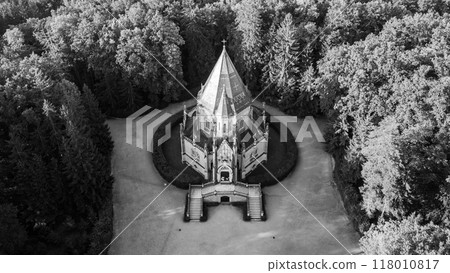The Schwarzenberg Tomb stands majestically in Domanin near Trebon, surrounded by lush greenery. The intricate architecture is complemented by a serene garden. Black and white photography. The Schwarzenberg Tomb stands majestically in Domanin near Trebon, surrounded by lush greenery. The intricate architecture is complemented by a serene garden. Black and white photography. 118010817