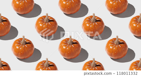 Orange pumpkin pattern on pastel color background 118011332