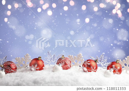 Christmas balls and snowflake with snow on color background Christmas balls and snowflake with snow on color background 118011333