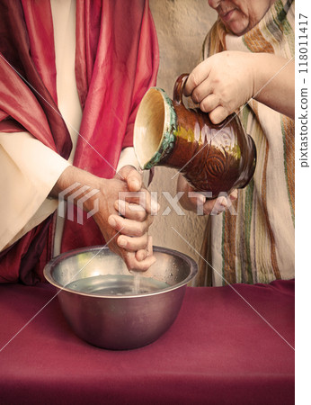 The servant pours water, and the master washes his hands 118011417