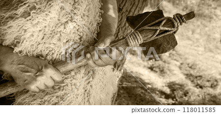 Stone ax of a primitive man Stone ax of a primitive man 118011585