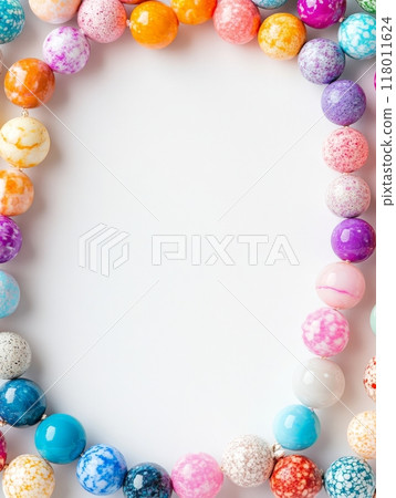 A beautiful array of colorful beads arranged in a circular pattern, highlighting various sizes and designs ideal for jewelry crafting or fashion statements A beautiful array of colorful beads arranged in a circular pattern, highlighting various sizes and designs ideal for jewelry crafting or fashion statements 118011624
