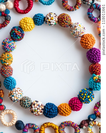 A vibrant arrangement of handmade accessories is displayed in a circular pattern. Each piece features unique colors and textures, highlighting creativity and craftsmanship 118011661